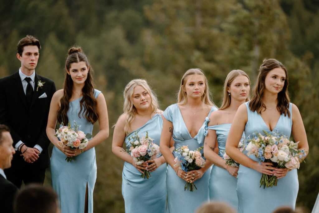 Bridal party smiling during wedding ceremony at Woodlands