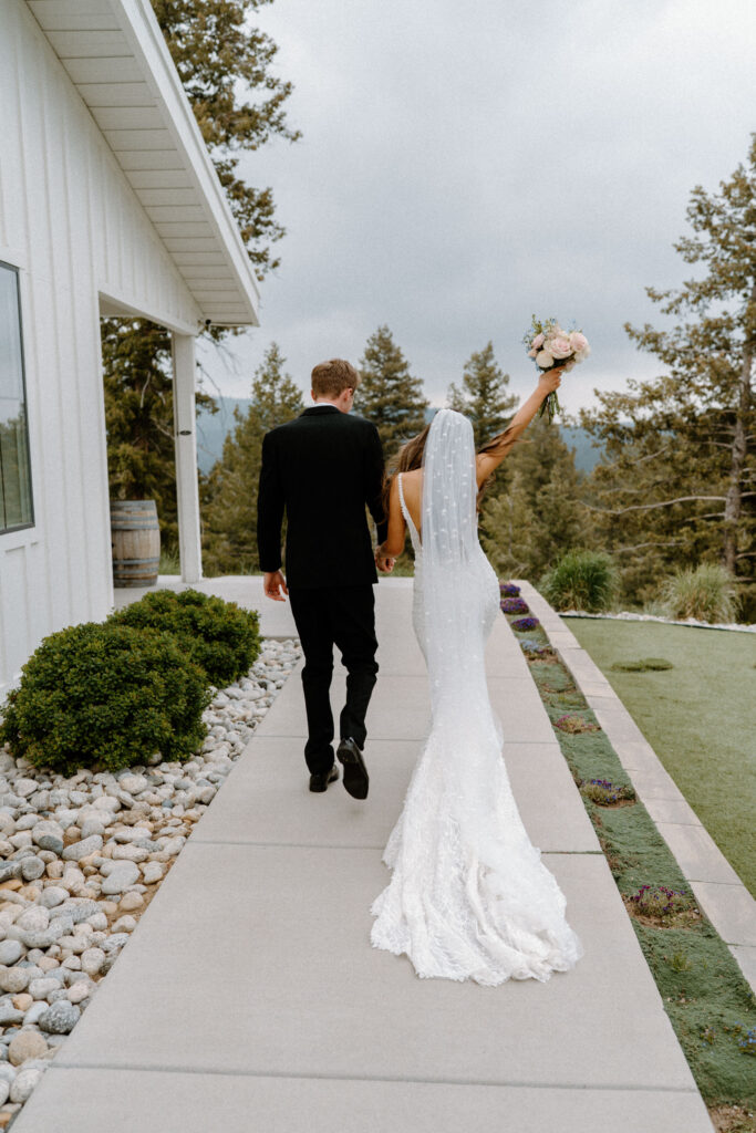 Bride and groom walking away from ceremony on wedding day at Woodlands