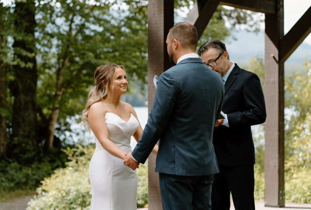 Bride smiling during the ceremony at an elopement at Glacier National Park