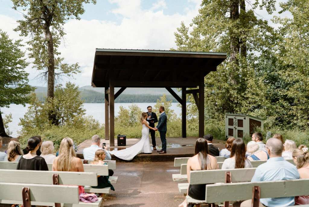Bride and groom standing at the alter during an elopement at Glacier National Park