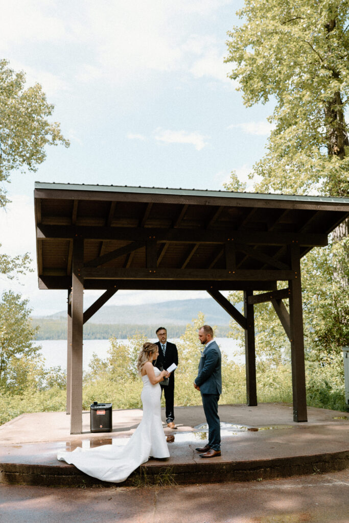 Bride reading vows during an elopement at Glacier National Park