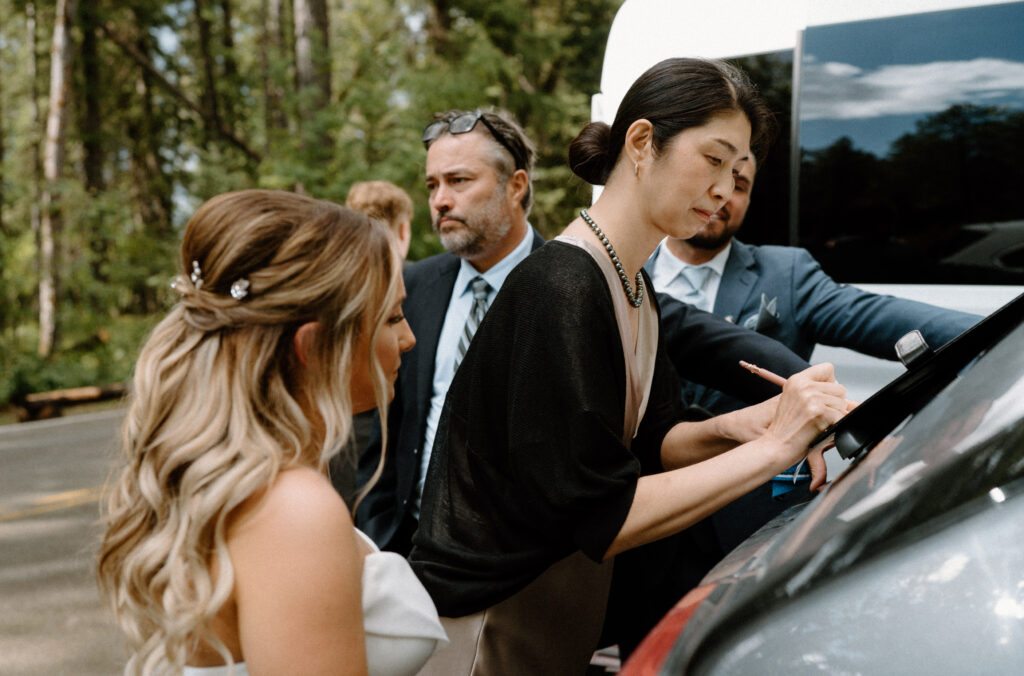 Witness signing marriage license during an elopement at Glacier National Park