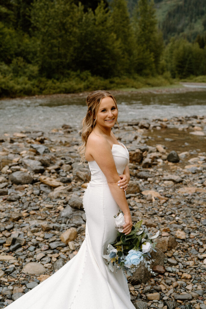 Bride smiling at the camera during an elopement in Glacier National Park