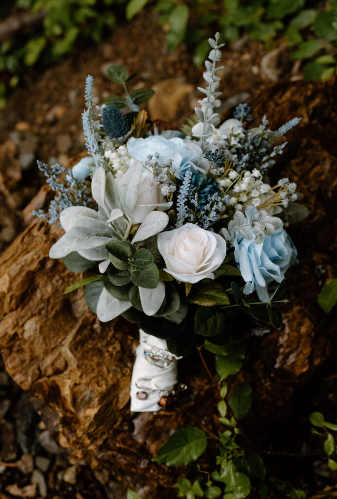 Bride's bouquet on a rock during an elopement in Glacier National Park