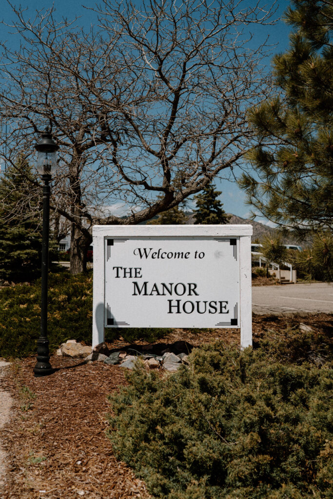 Welcome sign to The Manor House on wedding day