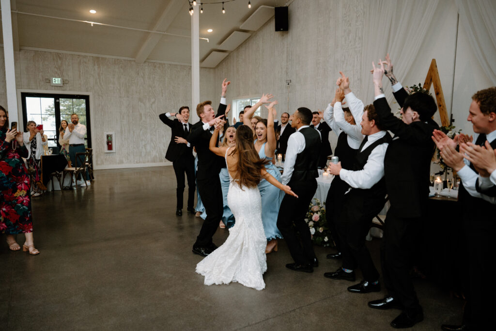 Wedding party cheering on wedding day at Woodlands