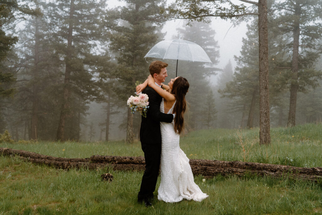 Bride and groom hugging on wedding day at Woodlands
