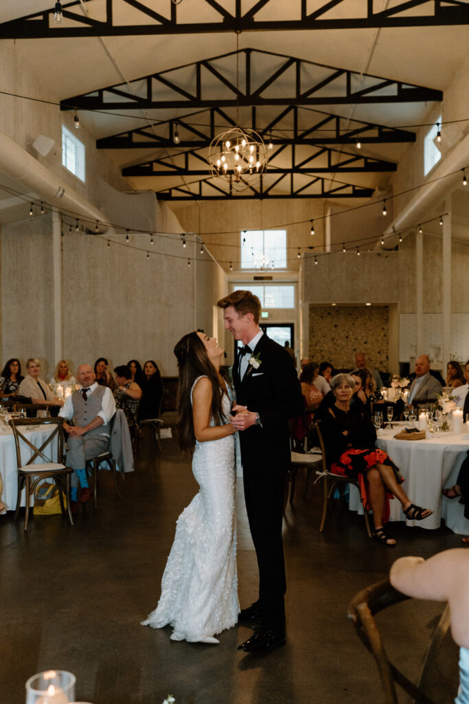  Bride and groom having their first dance on wedding day at Woodlands