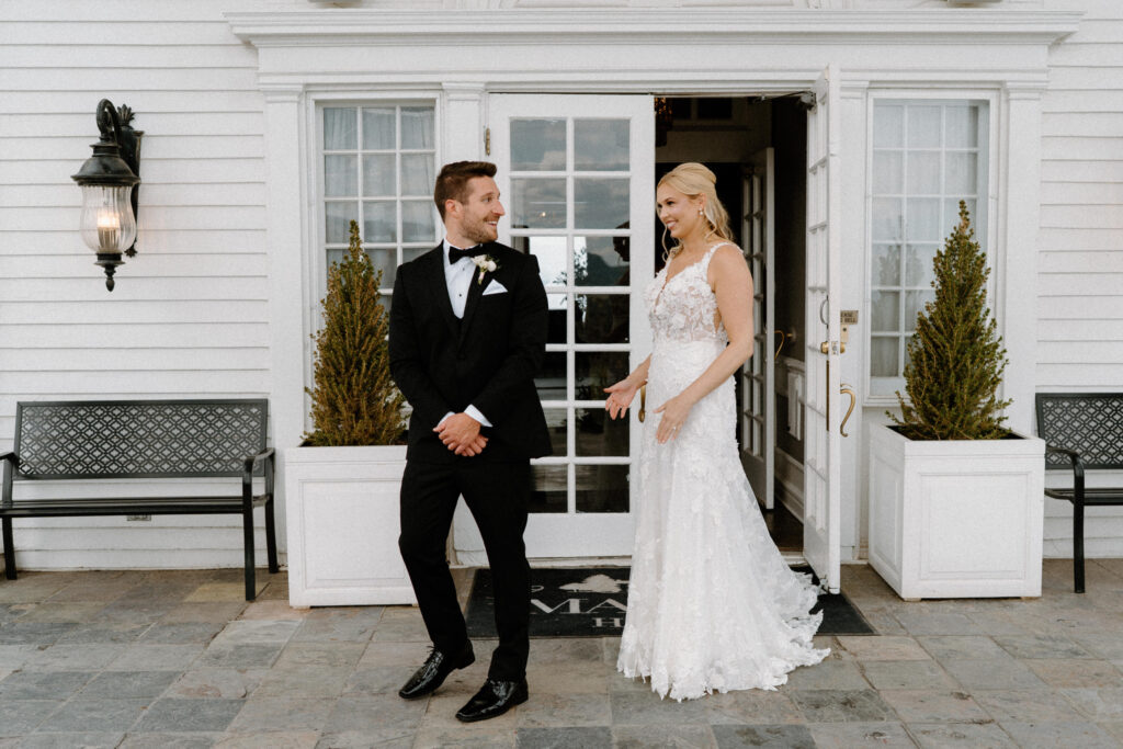 Groom turning around to see bride during first look on wedding day