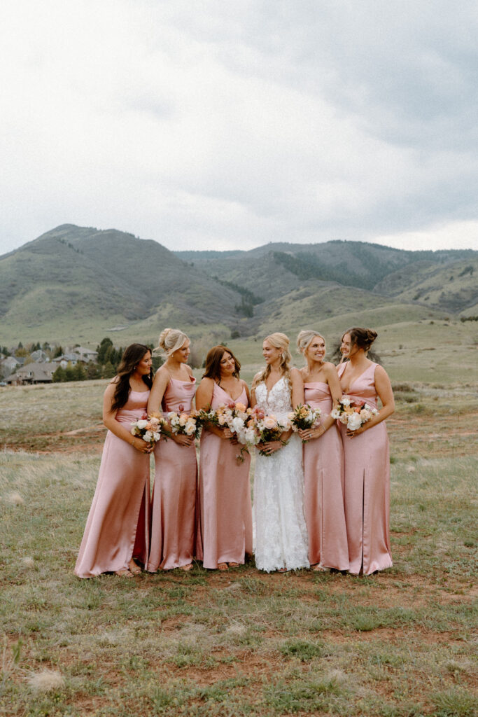 Bride and bridesmaids smiling on wedding day at The Manor House