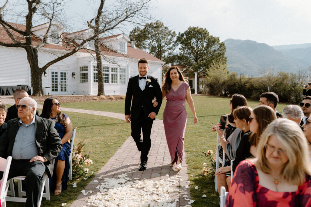 Groom walking down the aisle on wedding day at The Manor House