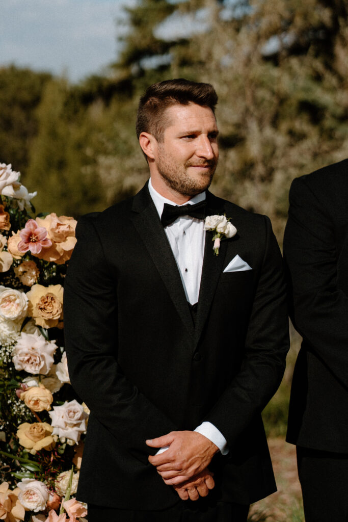 Groom standing at the alter on wedding day at The Manor House