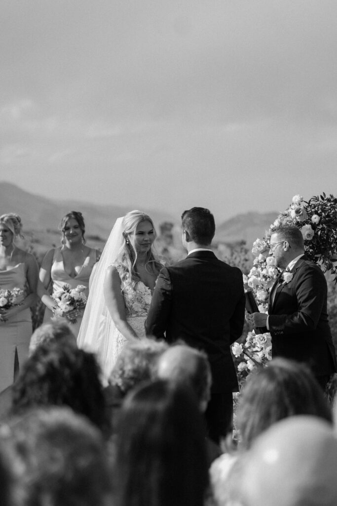 Bride smiling at the alter on wedding day at The Manor House