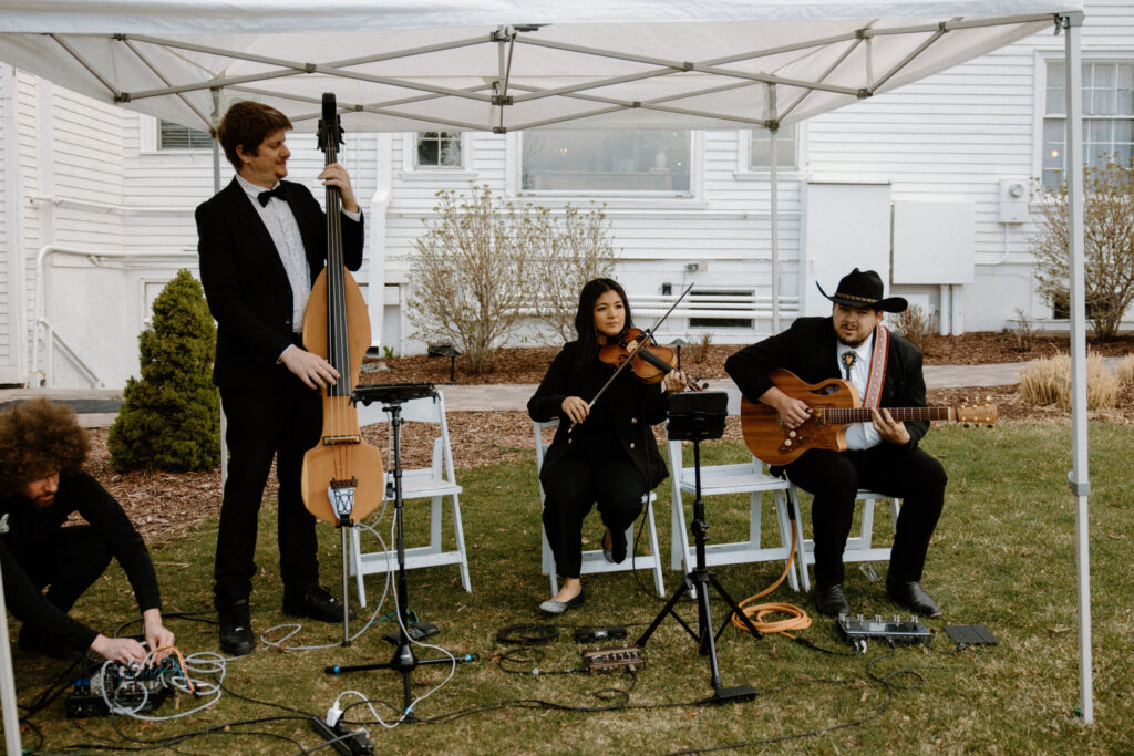 String trio playing at a wedding at The Manor House