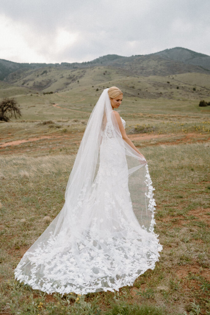 Bridal portrait in a field at Manor House on wedding day